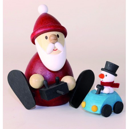 Weihnachtsmann mit ferngesteuertem Auto
