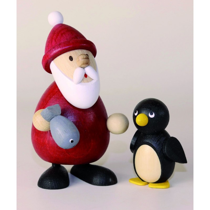 Weihnachtsmann mit Fisch und Pinguin