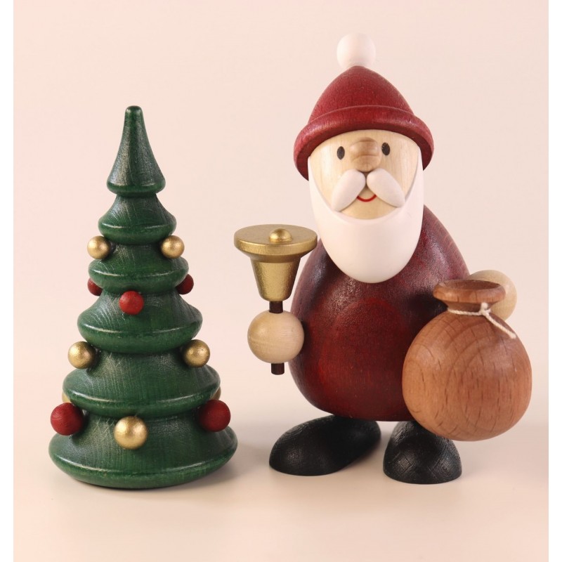 Weihnachtsmann mit Glocke und Sack am Weihnachtsbaum