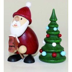Weihnachtsmann mit Steckenpferd und Weihnachtsbaum