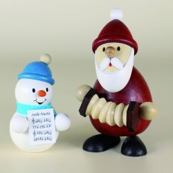 Weihnachtsmann mit Zieharmonika und Schneemann